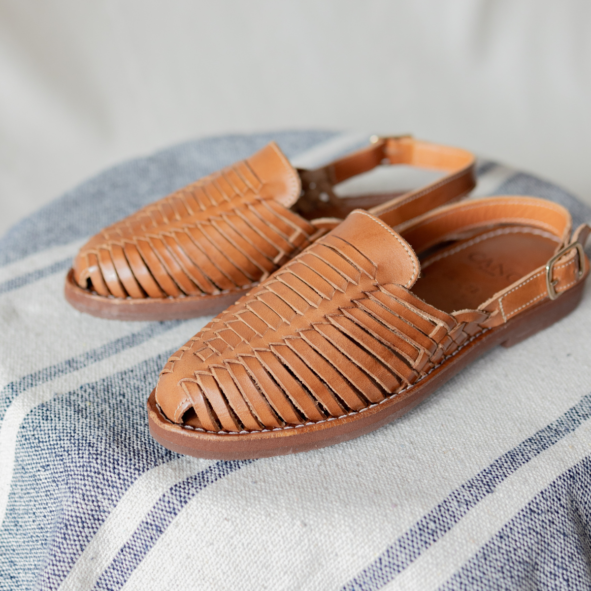 Side view of fairly handmade Amelia Sandal in cognac